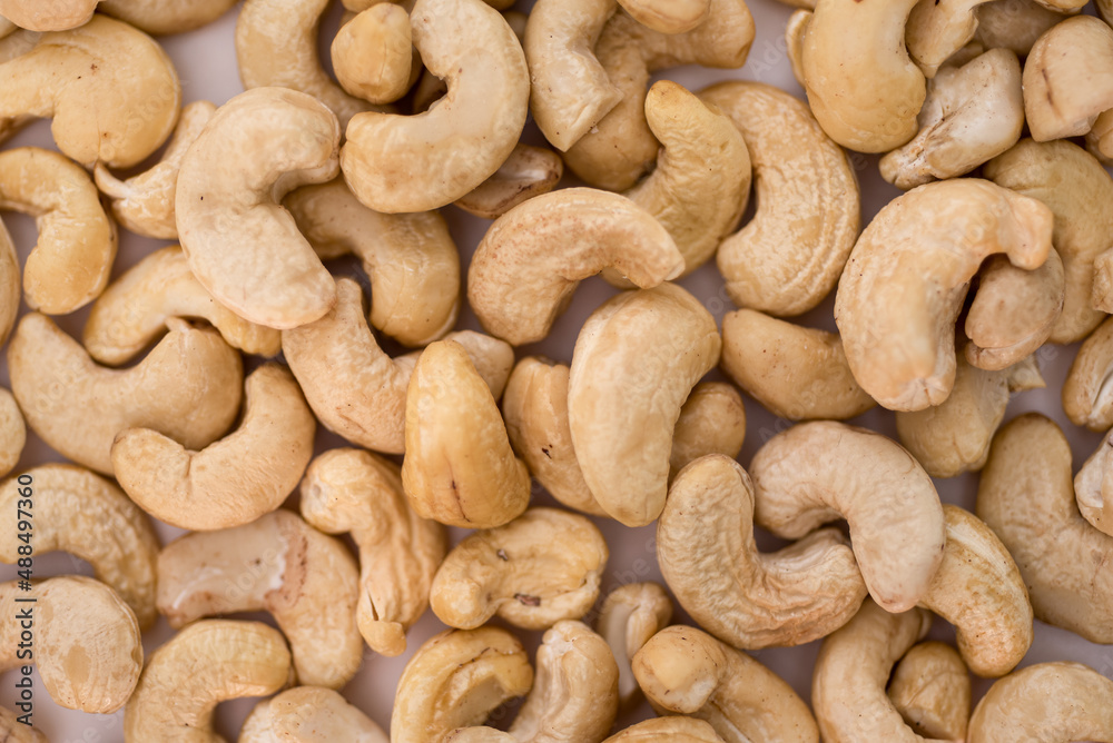 Tasty cashew nuts as background, top view Tasty cashew nuts as background, top view
