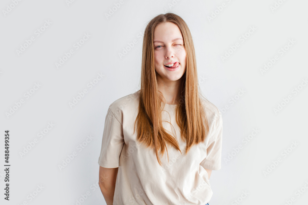 Portrait of young beautiful cute cheerful girl smiling over white background