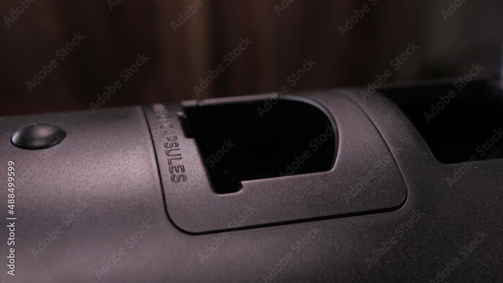 putting capsule into coffee machine slow motion 4k putting capsule into coffee machine slow motion 4k