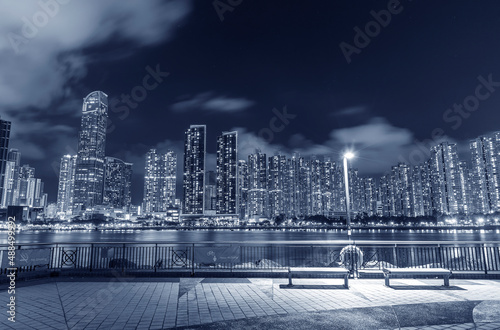 Seaside Promenade and skyline of Harbor in Hong Kong city at night