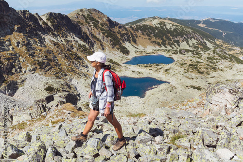 Hiker Woman in Rila Mountain with Stunning Lakes View. Musala Peak in Bulgaria in the Summer 