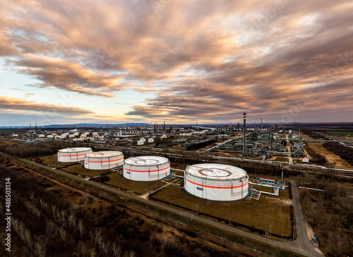 Oil refinery plant from industry zone, Aerial view oil and gas industrial, Refinery factory oil storage tank. Hungary Szazhalombatta.gas crisis. Oil crisis, European fuel deficiency.