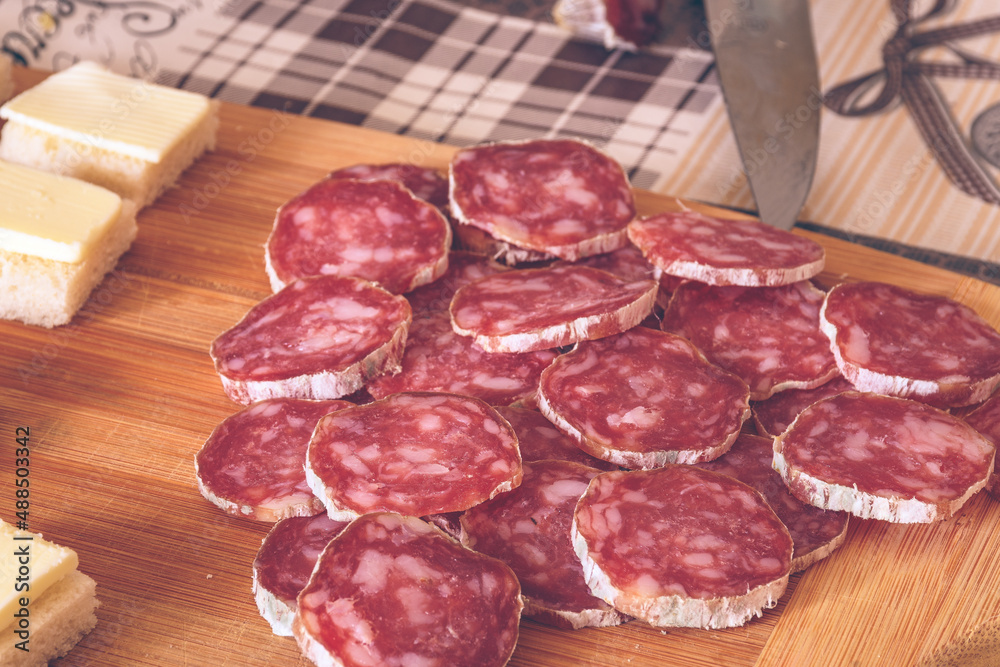 Italian Strolghino Salami On A Wooden Plate Italian Strolghino Salami On A Wooden Plate