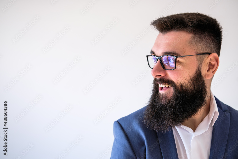 Portrait of happy businessman who is looking away and smiling. Copy space on image for your text or advert. Portrait of happy businessman who is looking away and smiling. Copy space on image for your text or advert.