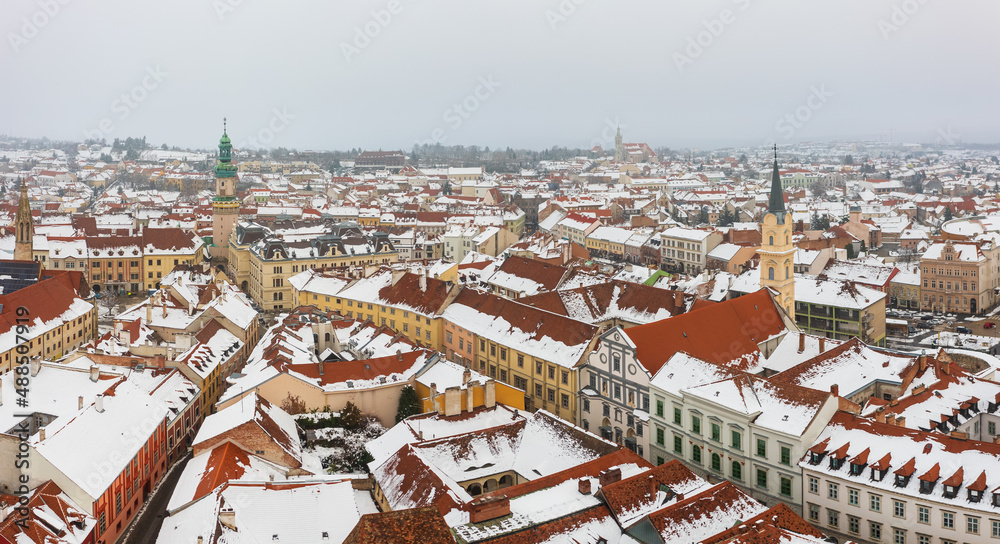 Obraz premium Aerial panoramic view about Sopron downtown. Winter cityscape, with snowy rooftops.