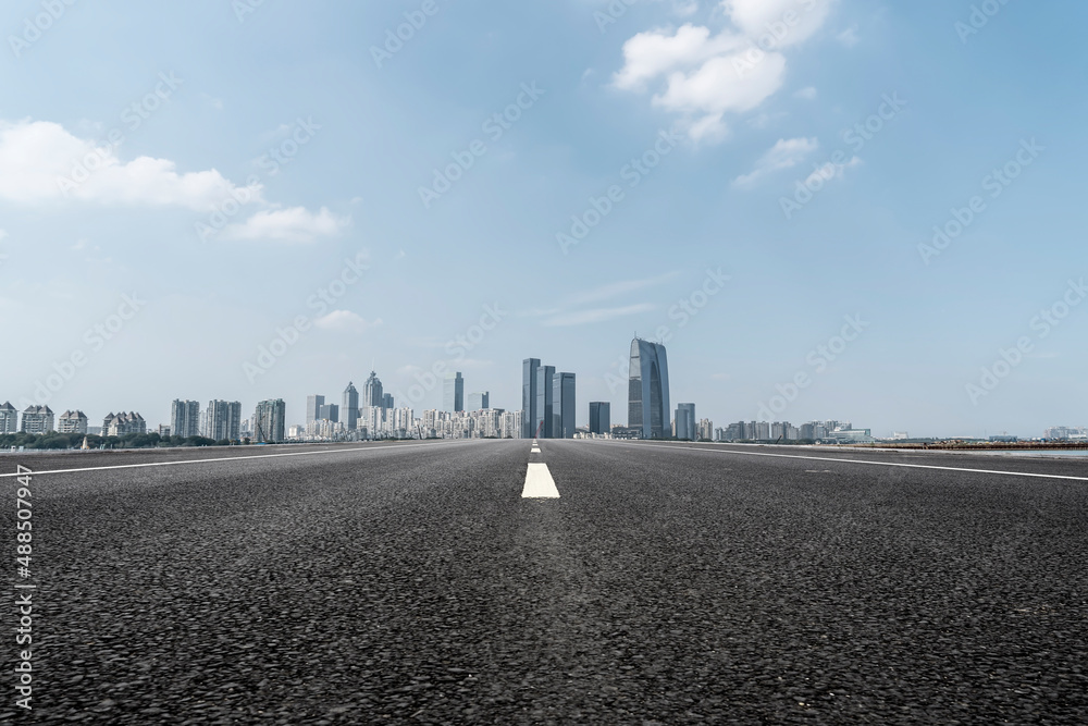 Fototapeta premium Road and Chinese modern city buildings background