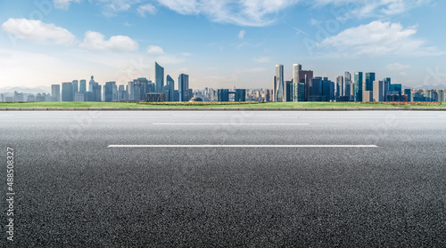 Fototapeta Naklejka Na Ścianę i Meble -  Road and Chinese modern city buildings background