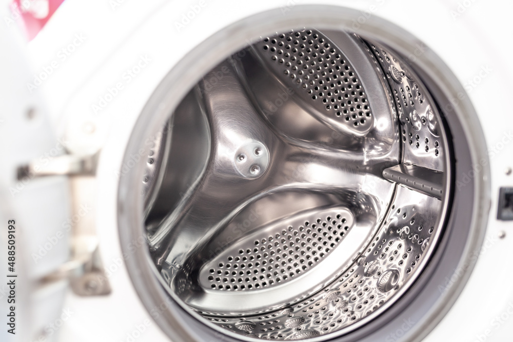 Drum of washing machine dry and clean close-up. Washing Dryer Machine inside view of a drum. Drum of washing machine dry and clean close-up. Washing Dryer Machine inside view of a drum.
