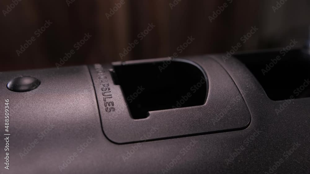 putting capsule into coffee machine slow motion 4k putting capsule into coffee machine slow motion 4k