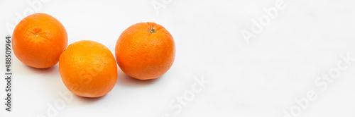 juicy oranges on a white background. sweet big tangerines on the table.orange citrus fruits on a light texture