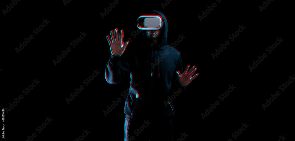 Virtual reality glass vr blured. Young man in digital glasses for 3d virtual reality game on dark background. Augmented reality, game, future technology concept. VR with glitch effect.