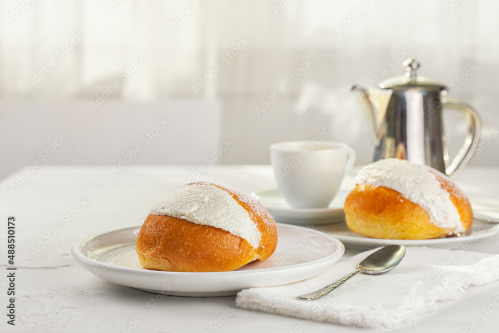 The Maritozzo. Classic sweet italian pastry, packed full of whipped cream and espresso coffee. The dough-based bun is typically eaten in Rome for breakfast. The Maritozzo. Classic sweet italian pastry, packed full of whipped cream and espresso coffee. The dough-based bun is typically eaten in Rome for breakfast.