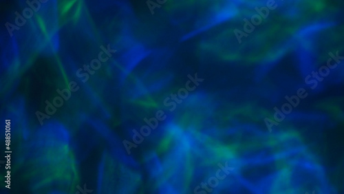 Blurry image of Abstract background. Green-blue light background. © nisara