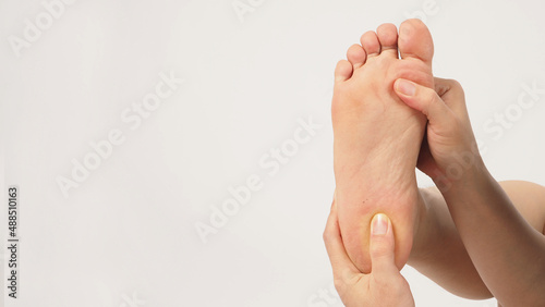 Asian Male soles barefoot and hand are isolated on white background. photo