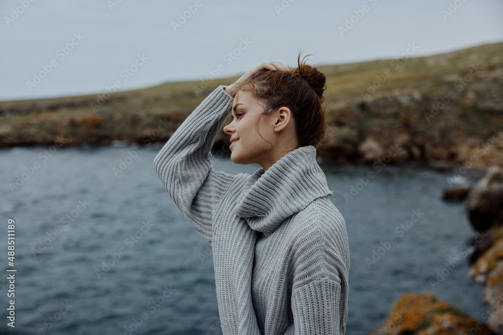 woman beach tourism cloudy weather stone coast female relaxing woman beach tourism cloudy weather stone coast female relaxing