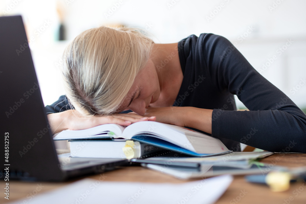 Depressed student having a lot to read. Depressed student having a lot to read.