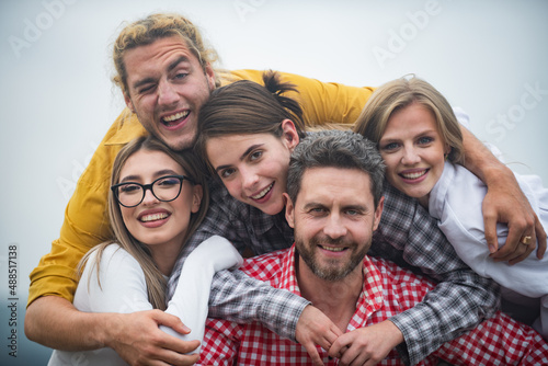 Group of happy people. Smiling friends laughing with thumb up. Company students best friends making selfies. Group young people team posing together. Multi ethnic business team. © Volodymyr