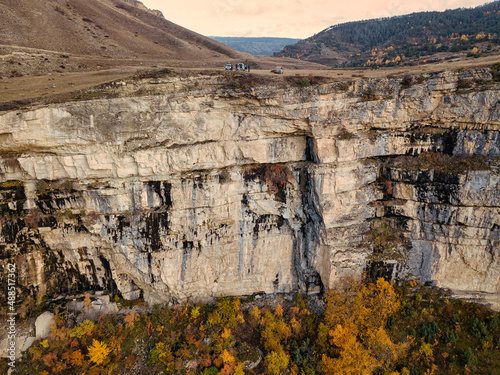 Aerial view of steep mountain cliff inautumn photo