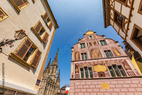 France, Alsace, Mulhouse, Low angle view of historical town hall and surrounding houses photo