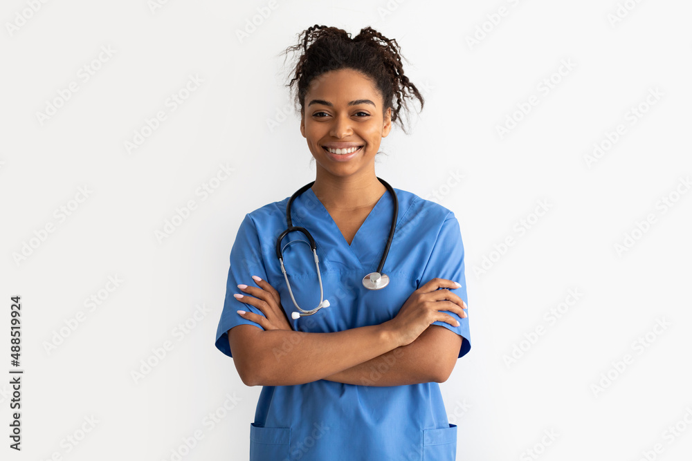 Portrait of black doctor looking at camera with folded arms