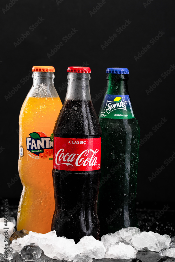 RUSSIA, MOSCOW - FEBRUARY 14, 2022 : a cold bottle of Coca-Cola, sprite,  fanta next to a black background фотография Stock | Adobe Stock
