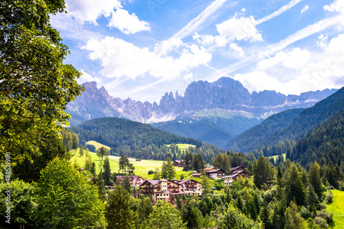 Italy, South Tyrol, Saint Cyprian, Mountain village in Fassa Valley during summer
