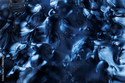 Full frame of clear blue melting ice