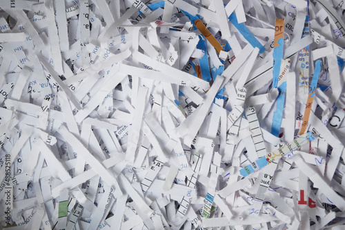Big stack of shredded documents to protect confidential information, safety is first concept, background, top view