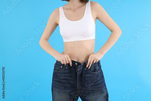 Concept of weight loss with slim girl