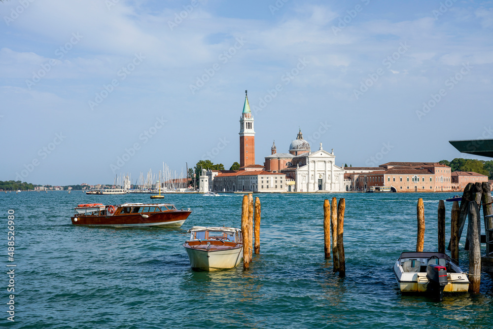 Italy, Veneto, Venice, Motorboats moored in marina with San Giorgio Maggiore island in background Italy, Veneto, Venice, Motorboats moored in marina with San Giorgio Maggiore island in background