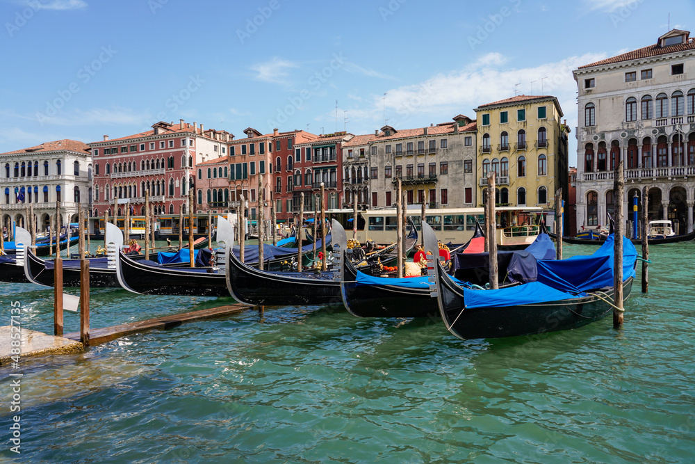 Italy, Veneto, Venice, Gondolas moored along city canal Italy, Veneto, Venice, Gondolas moored along city canal