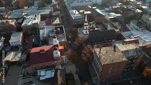 Church Street in Downtown Frederick, Maryland USA. Aerial View of Evangelical Reformed United Church of Christ, Trinity Chapel and Buildings on Sunny Fall Day, Drone Shot photo