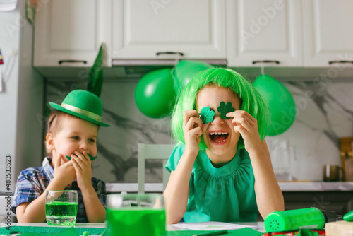 Two toddler boy and girl celebrate the holiday on March 17. Child celebrate St. Patrick's Day. Traditions, holidays concept.