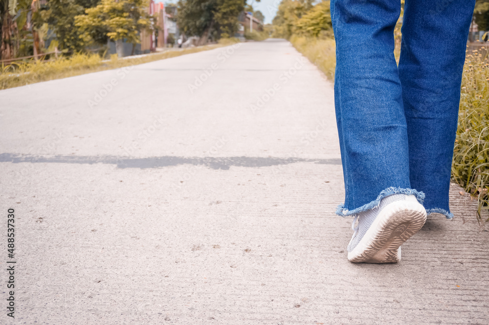 Man walking on the road Man walking on the road