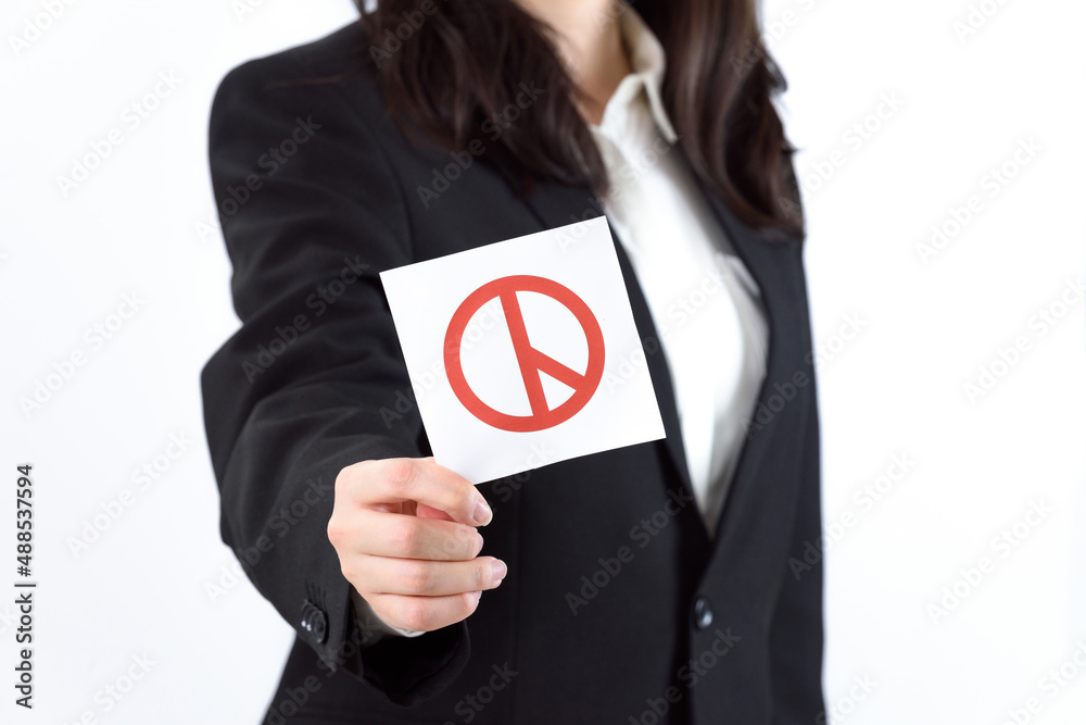 A Korean woman wearing a suit and holding a ballot. A Korean woman wearing a suit and holding a ballot.