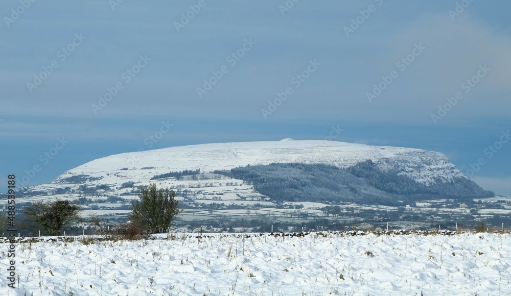 Snow-covered Knocknarea mountain in County Sligo, Ireland in wintertime