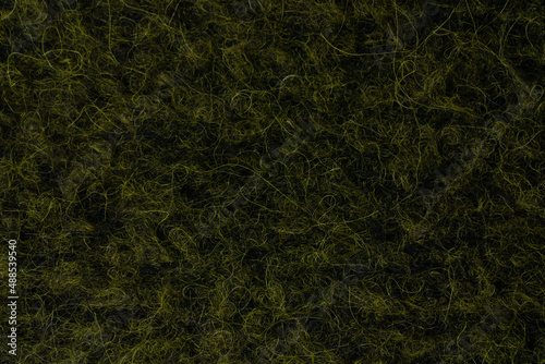 Dark green wool texture closeup