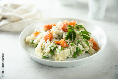 Homemade risotto with salmon and green pea