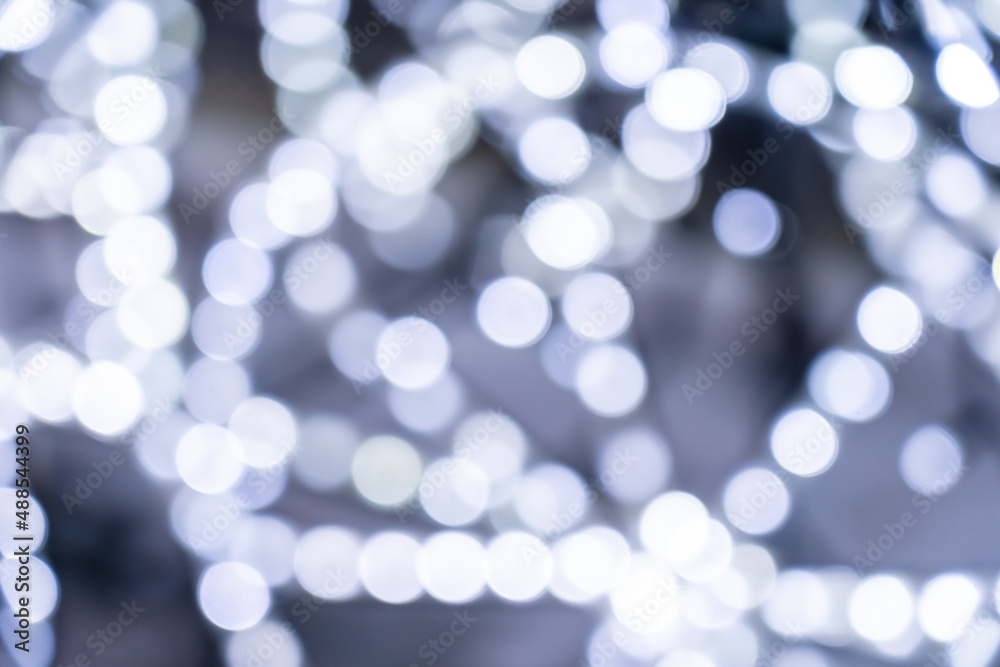 Elegant and romantic white Christmas lights background with bokeh