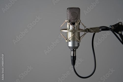 Silver studio condenser microphone on stand photo