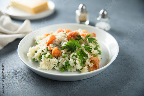 Homemade risotto with salmon and green pea