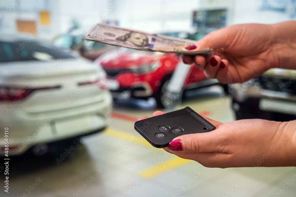custom made wallpaper toronto digitalthe new owner of the car holds a handful of dollars and car keys in the car showroom.