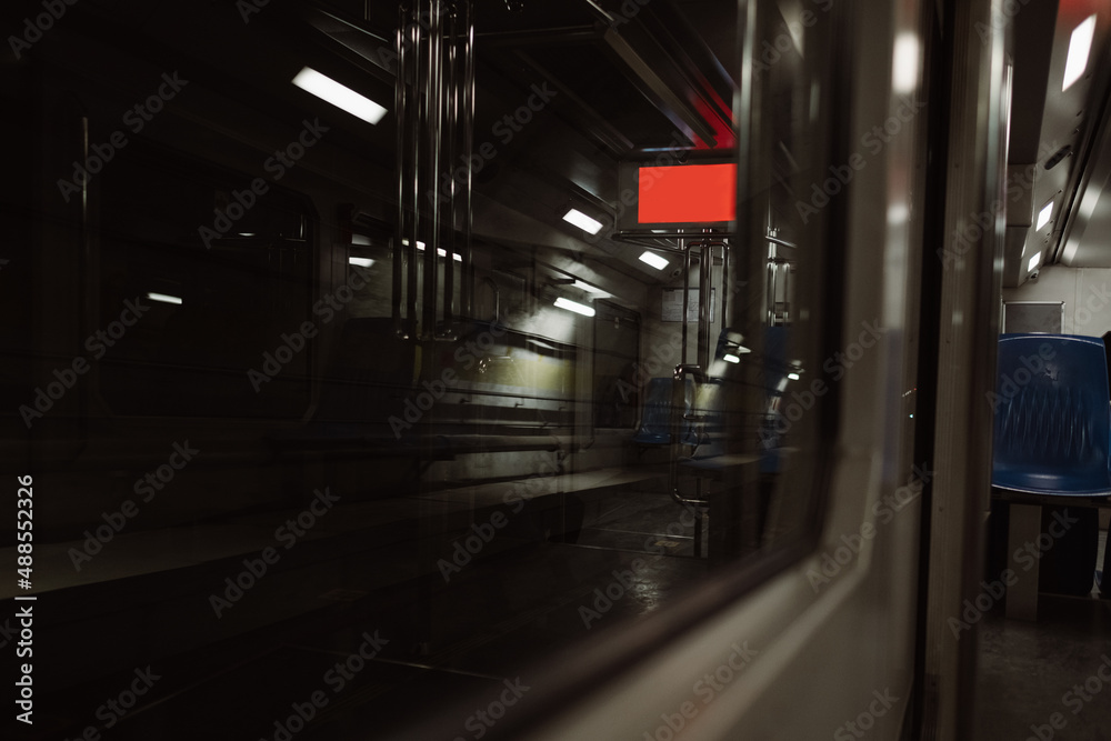 Metro, an empty underground subway, copy space in the red screen, train tracks and dramatic scenery