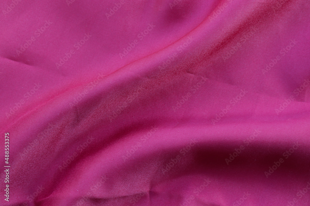 Red silk or satin luxury fabric texture can use as abstract background. Top view. Red silk or satin luxury fabric texture can use as abstract background. Top view.