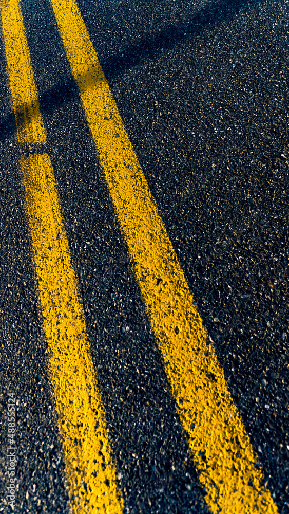 Fototapeta premium Yellow middle lines on the road