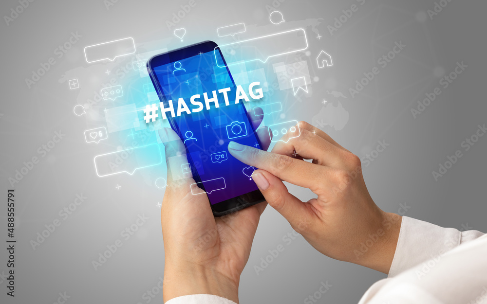 Hand using smartphone with social media concept Hand using smartphone with social media concept
