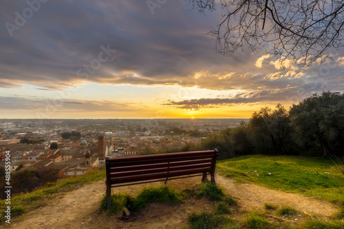 Bench and Pietrasanta panoramic view at sunset, Versilia, Lucca, Tuscany, Italy
