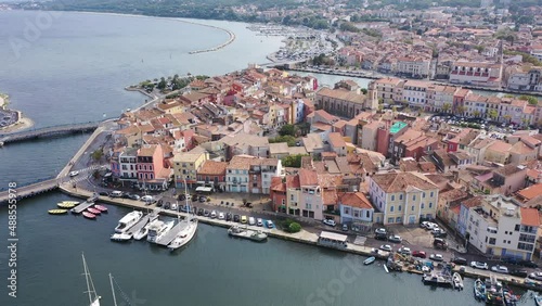 Aerial view of the administrative center with residential areas of the seaside town of Martigues, located on the Mediterranean coast, France. High quality 4k footage