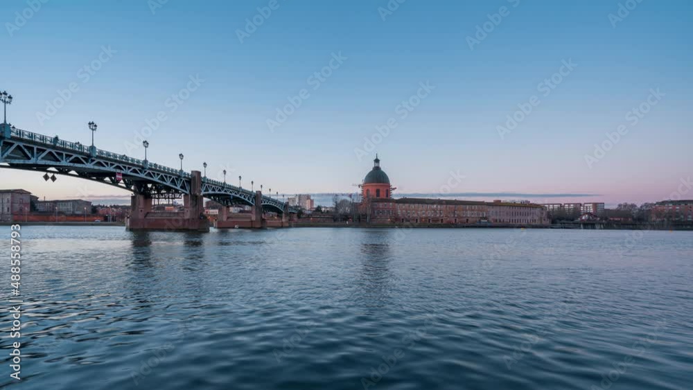 Toulouse sunrise timelapse, Garonne river and Dome of the 'Hopital de la Grave' at dusk