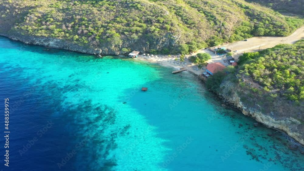 Aerial view of the coast of Curaçao in the Caribbean Sea with turquoise water, cliff, beach, and beautiful coral reef around Vaersenbay Aerial view of the coast of Curaçao in the Caribbean Sea with turquoise water, cliff, beach, and beautiful coral reef around Vaersenbay